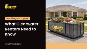 Overfilling a Dumpster shown with a Bin King dumpster overflowing with yard and household debris in a residential Clearwater driveway.